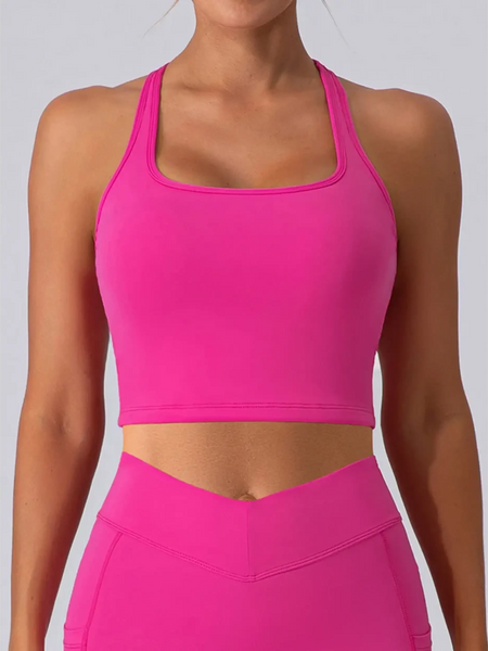 Babe Beachwear bright pink women's racerback crop top active tank worn by model