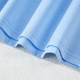 Close-up of light blue fabric hem of women's raglan short sleeve top by EG fashion