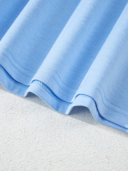 Close-up of light blue fabric hem of women's raglan short sleeve top by EG fashion