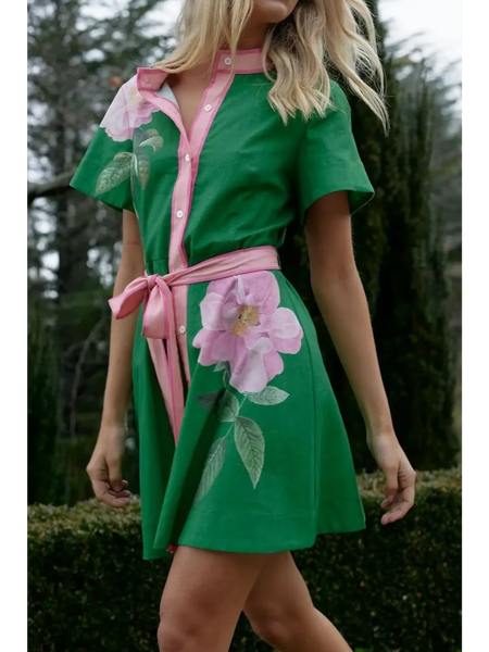 green women's resort wear short sleeve dress in green with pink floral accents and waist tie