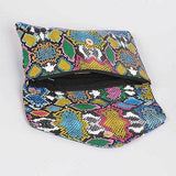 Babe Beachwaer women's snake print handbag with colorful pattern and snap closure open to show interior