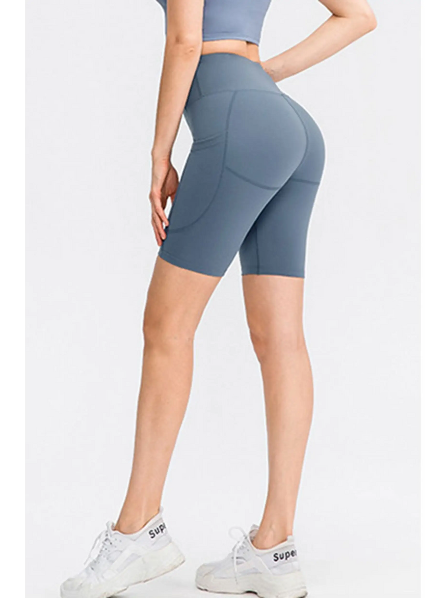 Babe Beachwear women's sports shorts with pockets in blue, high-waisted and fitted for active wear