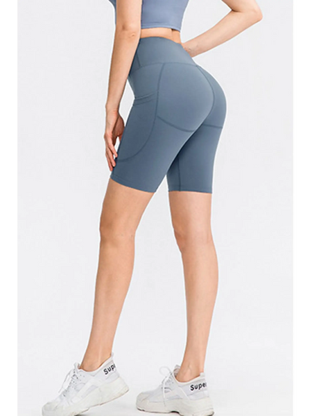 Babe Beachwear women's sports shorts with pockets in blue, high-waisted and fitted for active wear