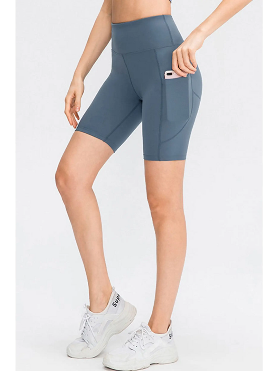 Babe Beachwear women's sports shorts with pockets in blue, featuring a high waist and side phone pocket