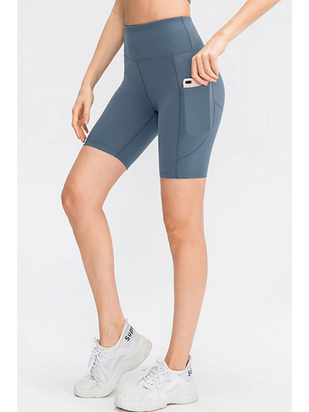 Babe Beachwear women's sports shorts with pockets in blue, featuring a high waist and side phone pocket