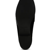 Sole view of women's studded suede loafers by Rag Company showing black textured outsole