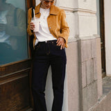 Rag Company women's studded suede loafers worn with casual outfit featuring white top and brown jacket