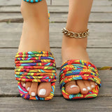Babe Beachwear women's stylish slip on sandals with colorful patterned fabric straps on wooden deck