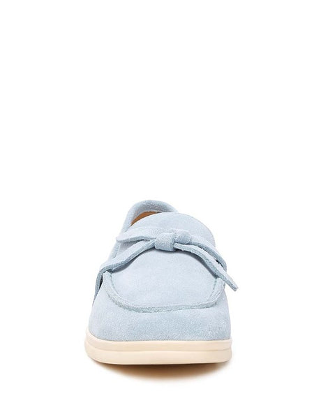 Rag Company women's suede loafers in light blue with bow detail and cream sole front view