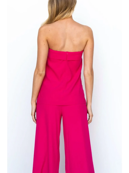 Trendsi women's tube top and pants set in vibrant pink shown from the back with strapless top and wide-leg pants