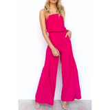 Women wearing hot pink women's tube top and pants set with wide leg pants and strapless top
