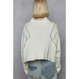 Back view of women's zip front sweatshirt in white with contrast stitching by Trendsi