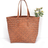 Babe Beachwear woven bamboo summer handbag with leather handles and woven texture