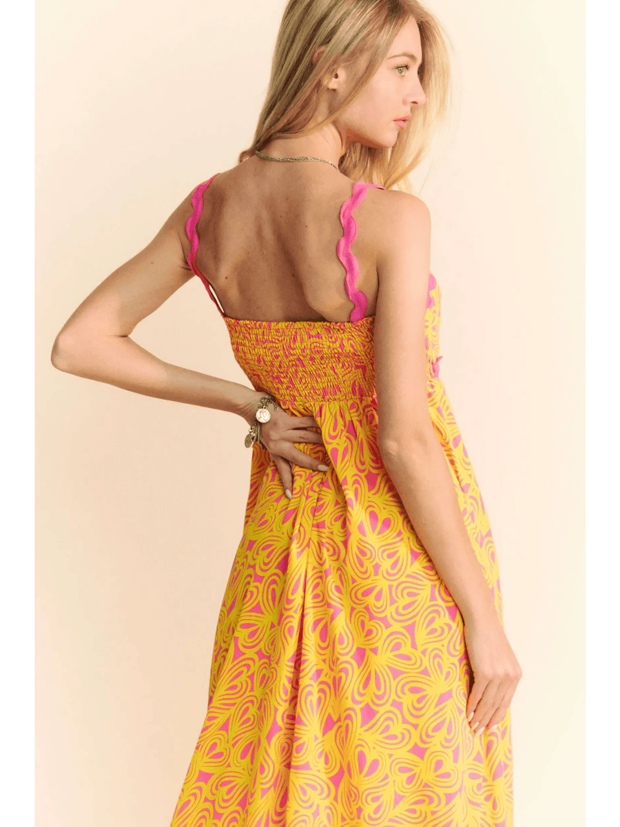 Trendsi yellow floral sundress for travel with pink straps and maxi dress style on model