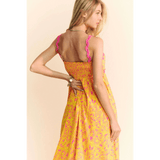 Trendsi yellow floral sundress for travel with pink straps and maxi dress style on model
