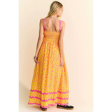 Trendsi yellow floral sundress for travel with pink straps and maxi flowy design
