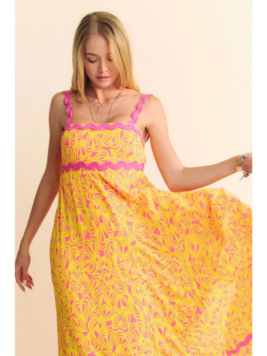 Trendsi yellow floral sundress for travel with pink trim and flowing maxi dress design