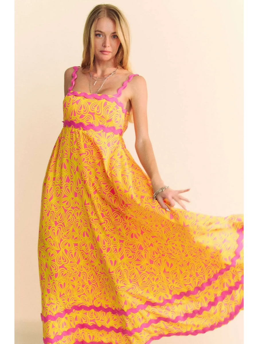 Trendsi yellow floral sundress for travel with pink trim and flowy maxi design