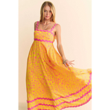 Trendsi yellow floral sundress for travel with pink trim and flowy maxi design