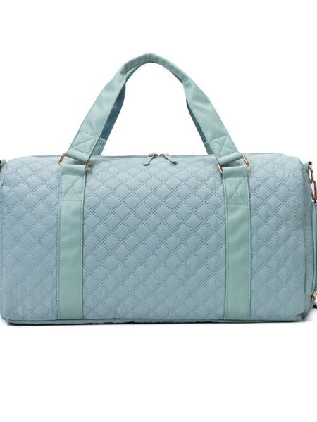 Babe Beachwear Zahra carry on overnight bag in light blue quilted fabric with handles and shoulder strap
