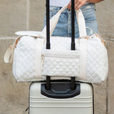 Babe Beachwear white quilted Zahra carry on overnight bag attached to silver hard suitcase