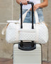 Babe Beachwear white quilted Zahra carry on overnight bag attached to silver hard suitcase